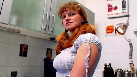 A curvy German babe gets her asshole smashed in the kitchen